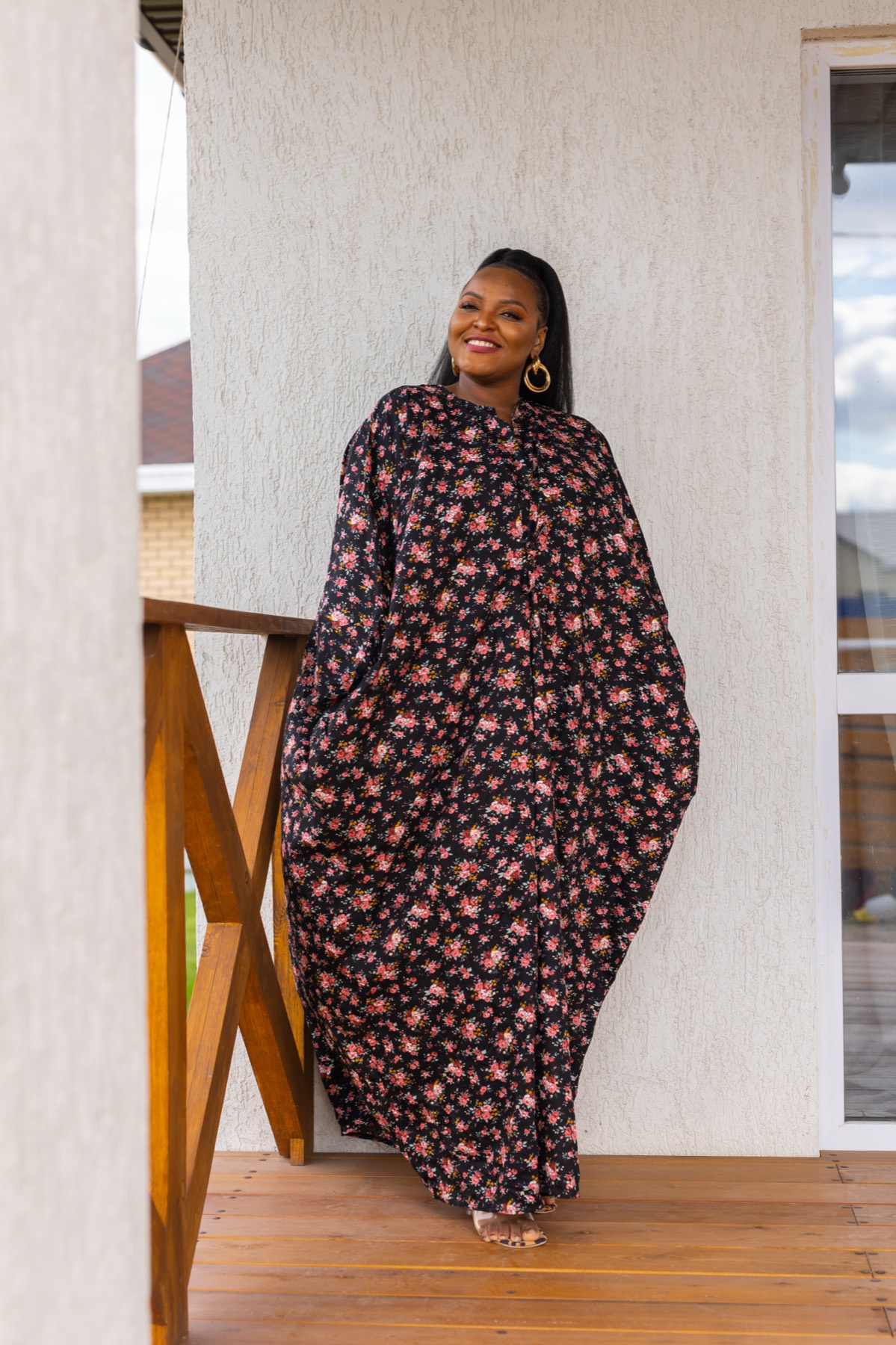 Model wearing a black floral Bubu dress